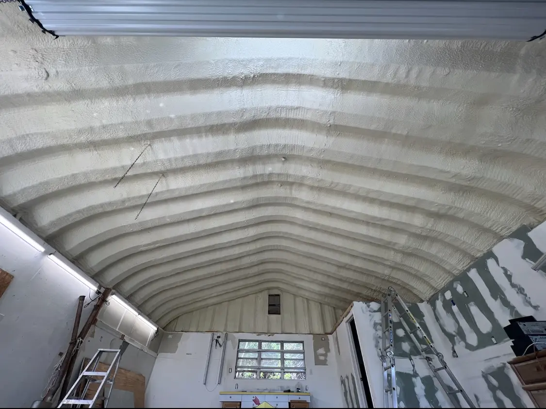 Spray polyurethane foam applied to the underside of a metal roof deck in Fort Stewart